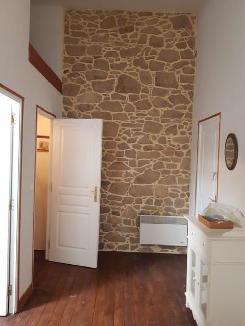 Huge Master bedroom with original Stone Wall