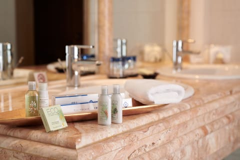 Deluxe Suite | Bathroom | Designer toiletries, hair dryer, bathrobes, slippers