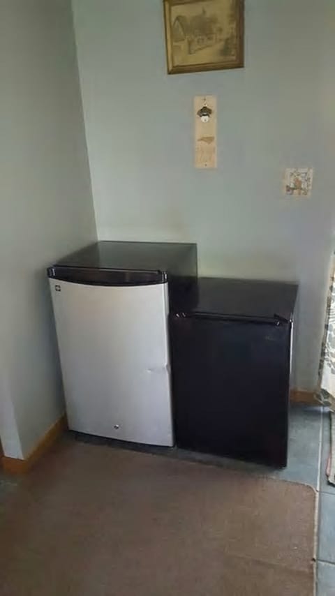 Two mini fridges for beverages.