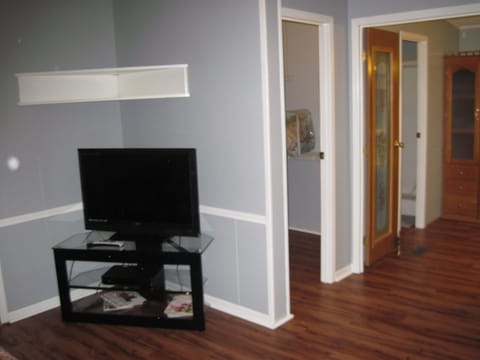 Master bedroom. TV and large walk in closet. Just ahead is master bathroom
