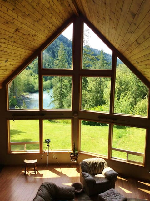 Mountains and river through prow window of great room