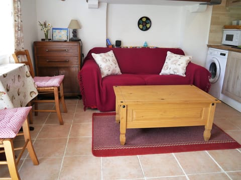 living room area with drop leaf dining table