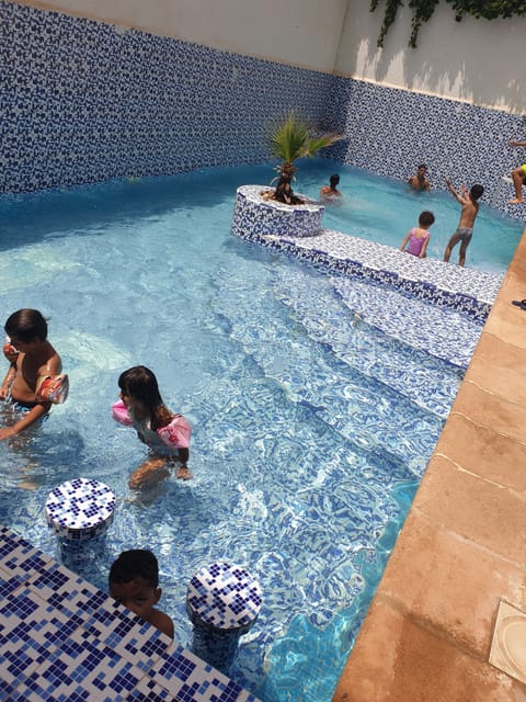 Seasonal outdoor pool, pool umbrellas, sun loungers