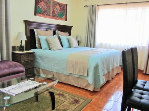 Suite, 1 King Bed, Garden View | Desk, blackout drapes, rollaway beds, free WiFi