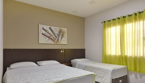 Family Triple Room | Minibar, desk, laptop workspace, free WiFi