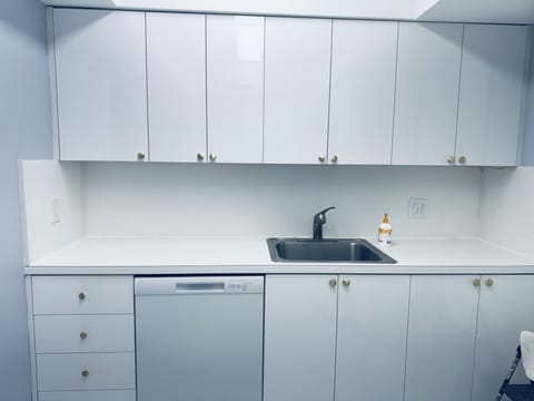 full size kitchen with dishwasher, oven, toaster and refrigerator