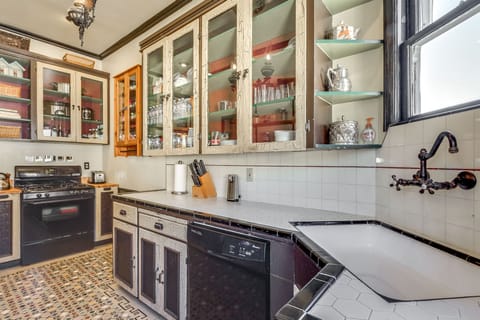 Original cabinets knife set, paper towels, toaster, gas oven & stove, dish was