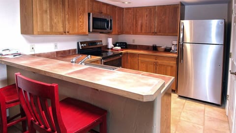 Kitchen: Refrigerator/Freezer, dishes, pots/pans, cooking utensils