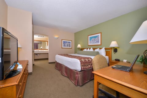 Suite, 1 King Bed, Non Smoking, Jetted Tub | 2 bedrooms, in-room safe, individually decorated, desk