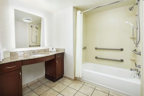 Suite, 1 King Bed, Accessible, Bathtub | Bathroom | Combined shower/tub, deep soaking tub, hair dryer, towels