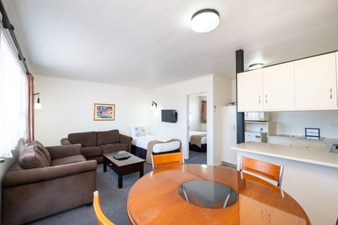 Twin Unit - Sleeps 3 | Living area | 32-inch flat-screen TV with satellite channels, TV