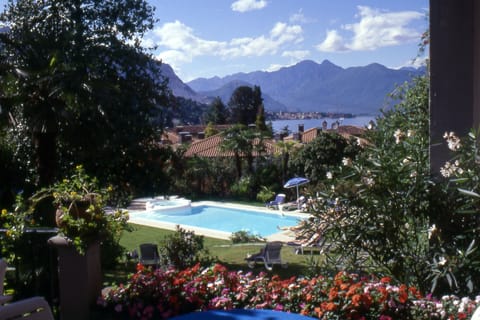 Seasonal outdoor pool, pool umbrellas, sun loungers