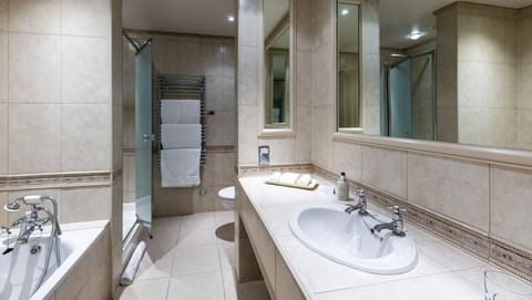 Suite | Bathroom | Designer toiletries, hair dryer, bathrobes, slippers