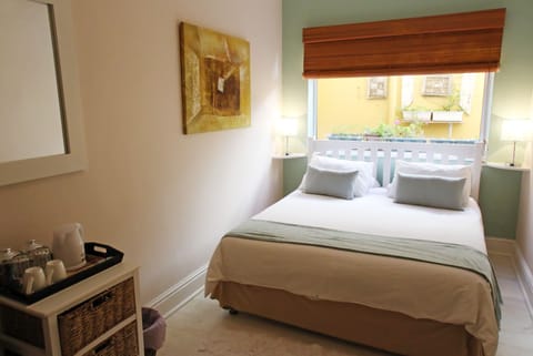 Economy Double Room, 1 Queen Bed | Minibar, individually decorated, laptop workspace, free WiFi