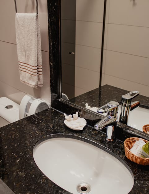 Suite, Private Bathroom (Exterior 1) | Bathroom | Shower, rainfall showerhead, free toiletries, towels