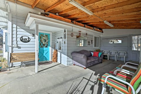 Covered porch is the perfect place to relax with a book and a glass of wine.