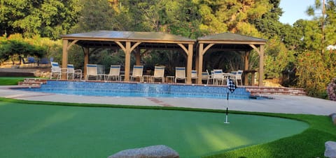 Beautiful Resort like setting of Gazebo overlooking Pool and Putting Green Area