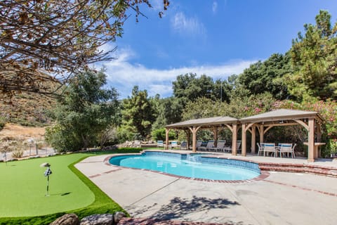 Pool and Golf area surrounded by mature trees and foothills is ultra private.