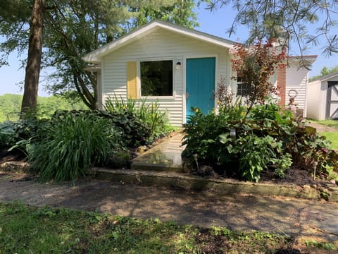 Front of our cozy cottage in Summer. Welcome….come on in. 