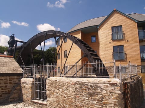 Outside the apartments and the restored waterwheel