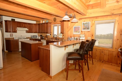 looking from breakfast bar into kitchen
