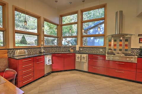 Kitchen with stone countertops and stainless steel appliances