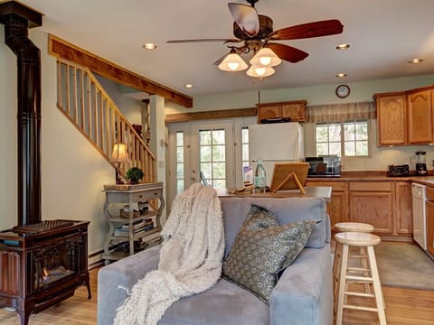 French doors = delightful cross-breeze; propane  designer stove; open kitchen