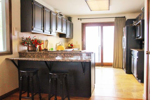 Enjoy Breakfast at the Eat-At Bar in the Updated Kitchen