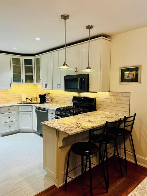 Updated kitchen photo with undercounted lighting in 2025.
