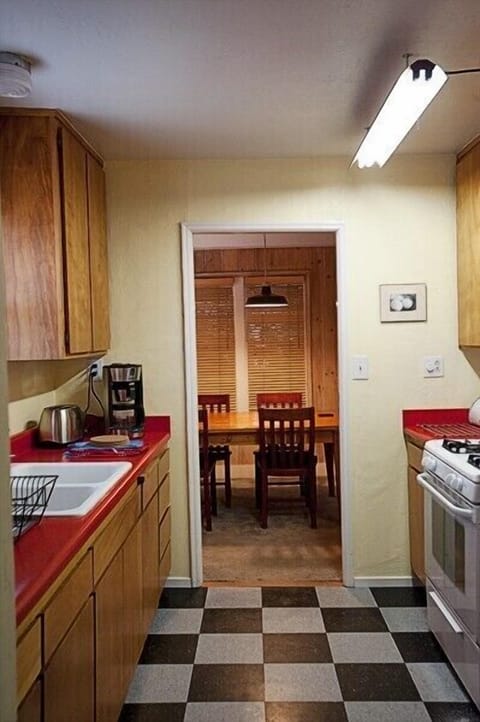Kitchen opens to the dining room to keep the cook in the flow of things.