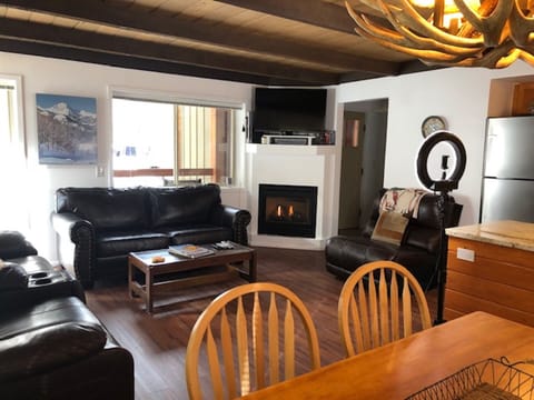 View of living room from dining area. You can see the front door in the pic.