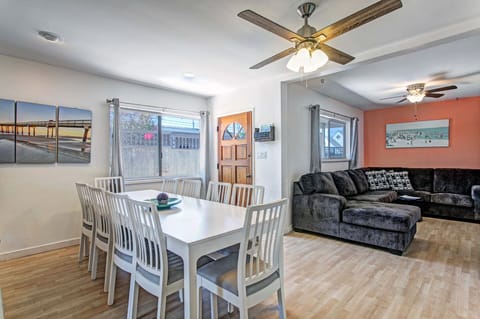 The dining room looks in the family room with a large sectional sofa.