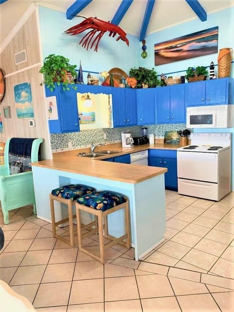 Kitchen has glass backsplash and all the conveniences of home!