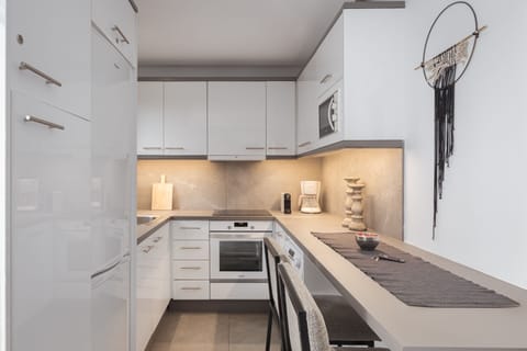 Acropolis Stylish Condo | Private kitchen | Full-size fridge, microwave, oven, stovetop