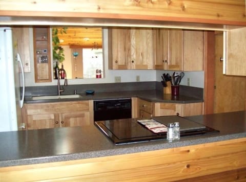 kitchen with jenn air range and pass thru into the gathering room.