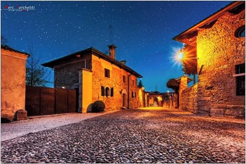 Night view of La Vicinia and castle's "old borgo"