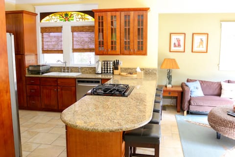 Enter the kitchen with large peninsula separates the great room and the kitchen