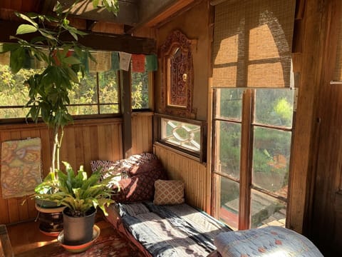 upstairs bright porchrom with single futon bed