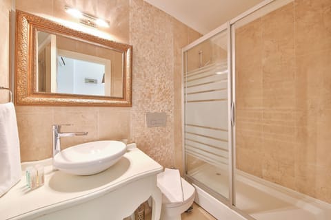 Shower, free toiletries, hair dryer, slippers