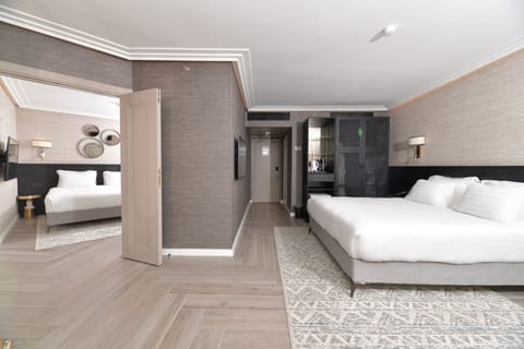 Family Suite, Balcony | In-room safe, desk, soundproofing, iron/ironing board