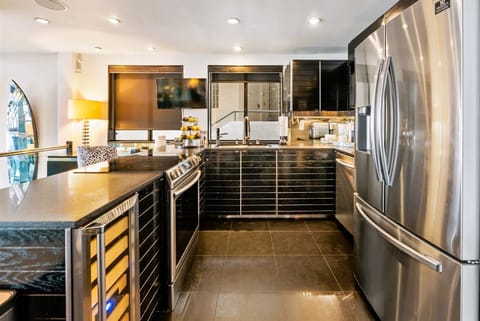 View of full kitchen including commercial icemaker