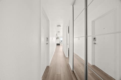 Mirrored custom closet & storage in beautiful hallway