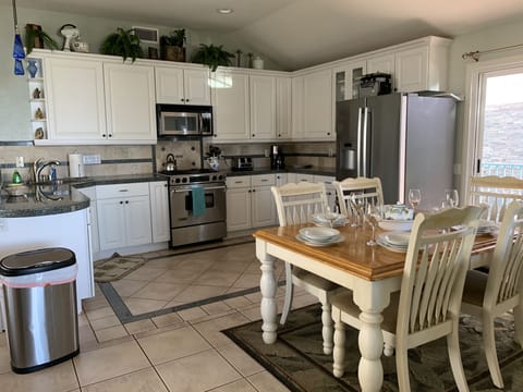 3 DOOR REFRIGERATOR. JENN AIR GAS STOVE
DISHWASHER LEFT OF SINK