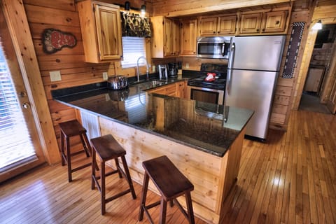 Fully stocked kitchen with granite counters.