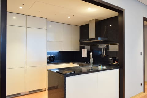 Deluxe Suite, 2 Bedrooms | Private kitchen | Fridge, microwave, oven, stovetop