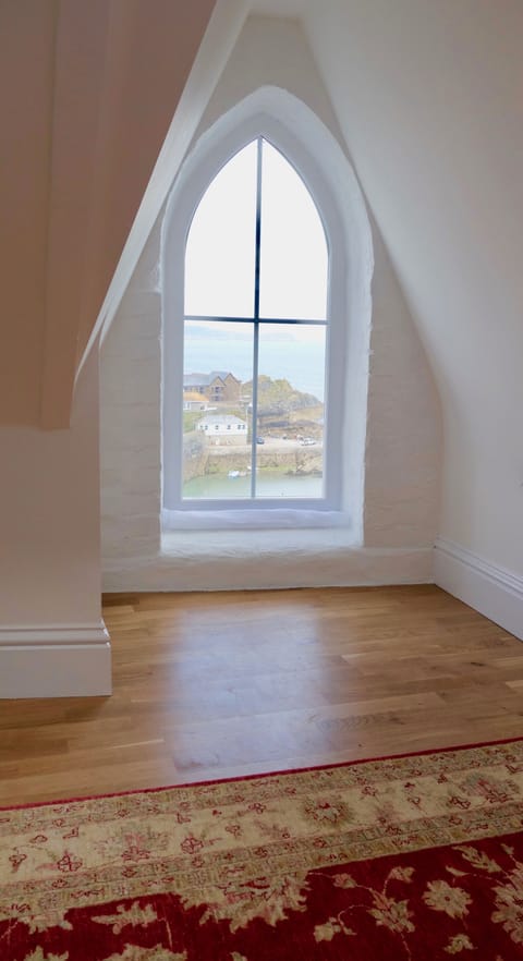 Attic gable window with a view out to sea
