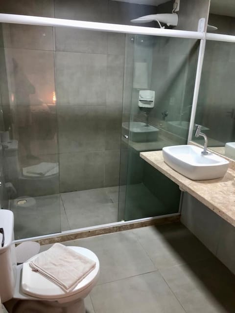 Quadruple Room | Bathroom | Shower, hair dryer, towels