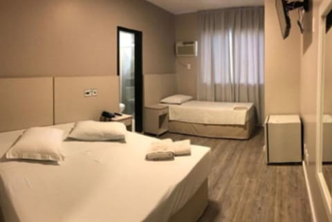 Economy Triple Room | Minibar, desk, blackout drapes, free WiFi