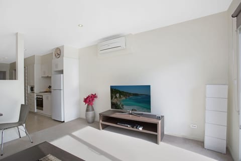 Executive Studio, 1 Bedroom | Living area | 50-inch flat-screen TV with digital channels, TV