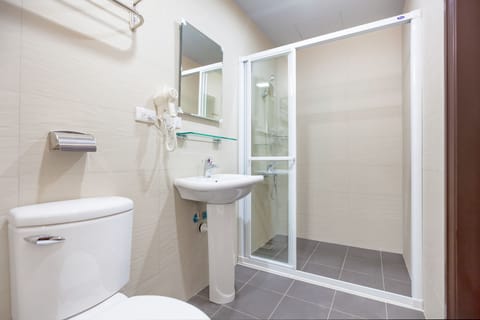 Economy Twin Room, No Windows | Bathroom | Shower, free toiletries, hair dryer, slippers